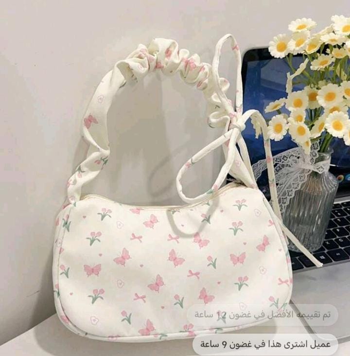 شنطة يد بيضاء
